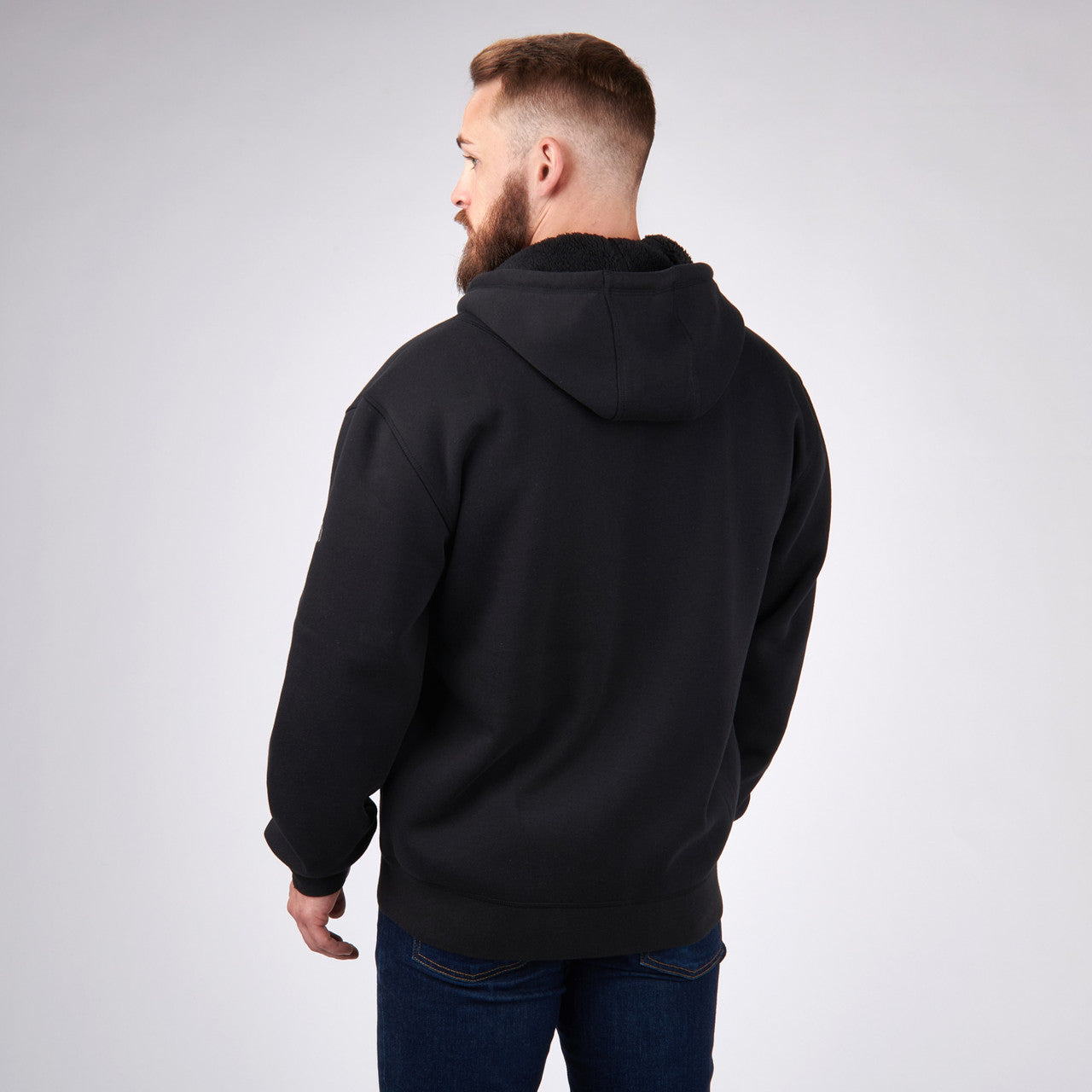 Man wearing Sierra Designs Men's Angora Hoodie, Black, rear view
