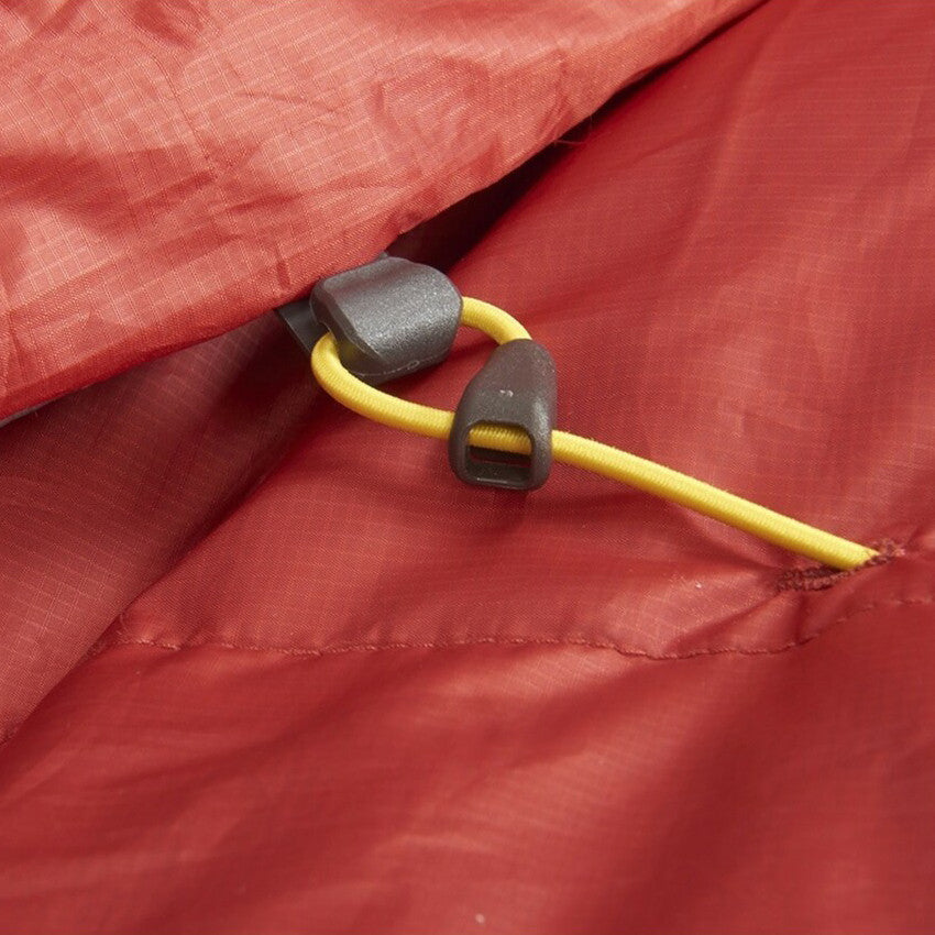 Close up of Sierra Designs Backcountry Bed 20 Duo sleeping bag, showing bungee cord attachment