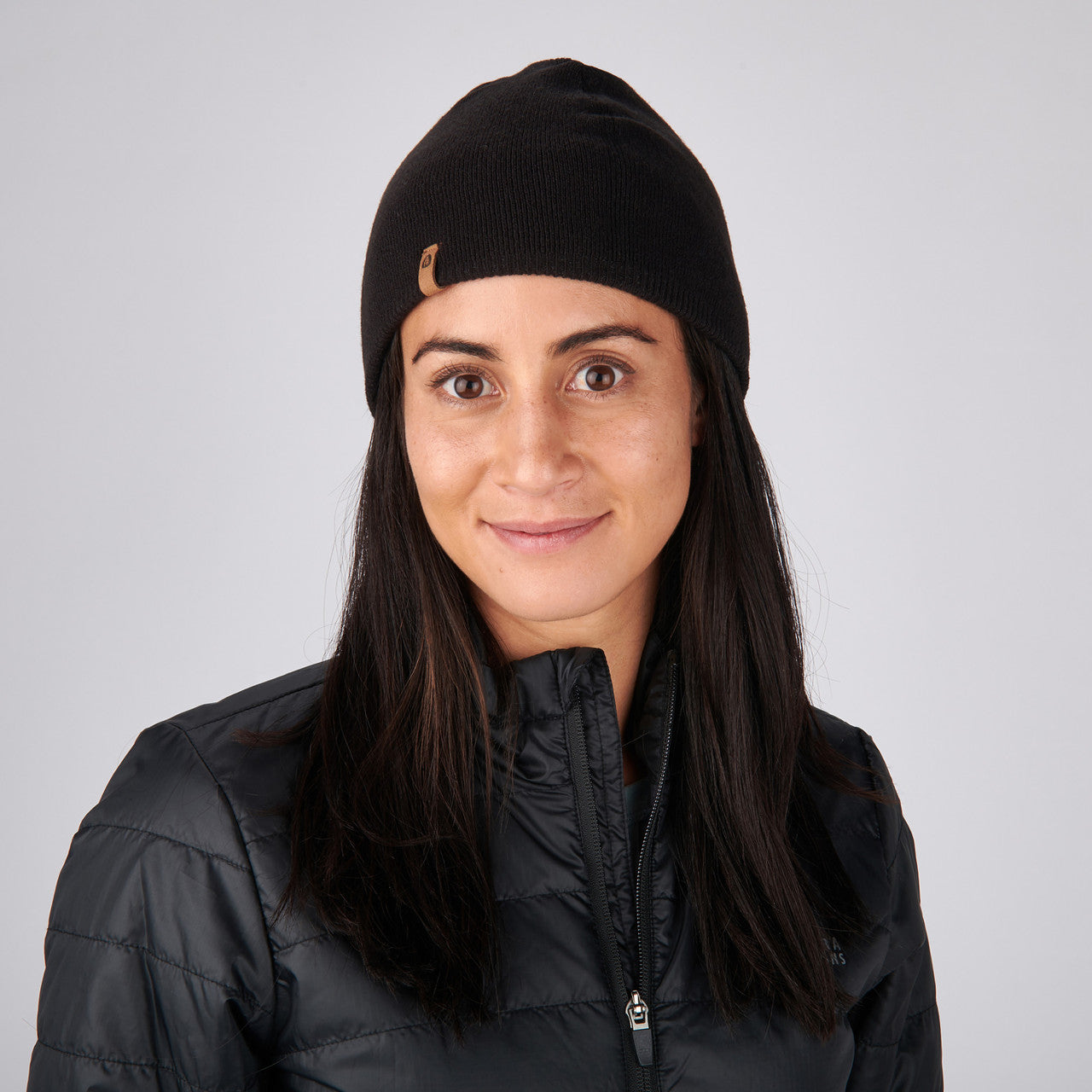 Woman wearing Sierra Designs Cleo Reversible Beanie, Black / Gun Metal, front view