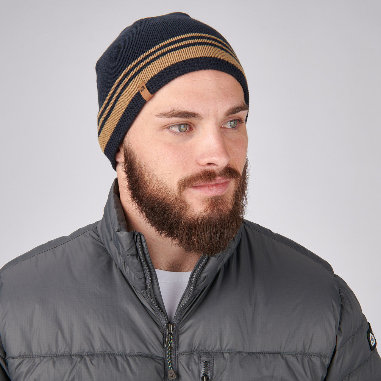 Man wearing Sierra Designs Cleo Reversible Beanie, Midnight Navy / Cornstalk