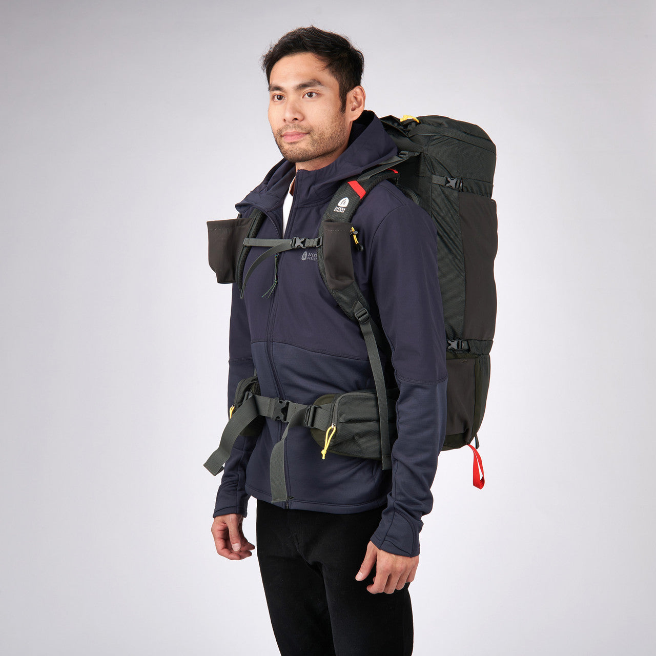 Man wearing Sierra Designs Flex Capacitor 40-60 backpack, Peat