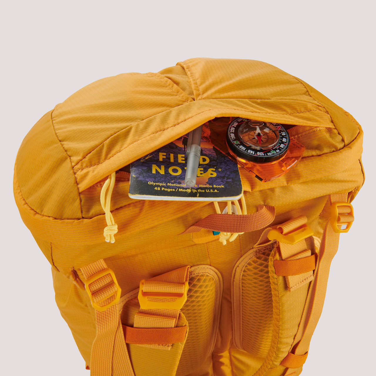 Sierra Designs Flex Capacitor 40-60 backpack, with lid unzipped to show storage