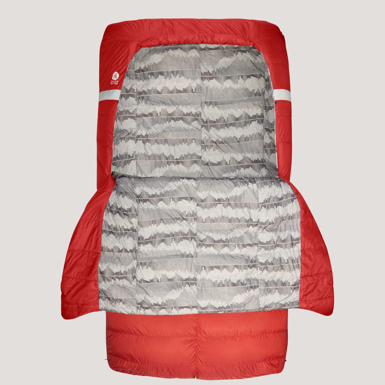 Sierra Designs Backcountry Bed 20 Duo sleeping bag, red, front view, with comforter folded out