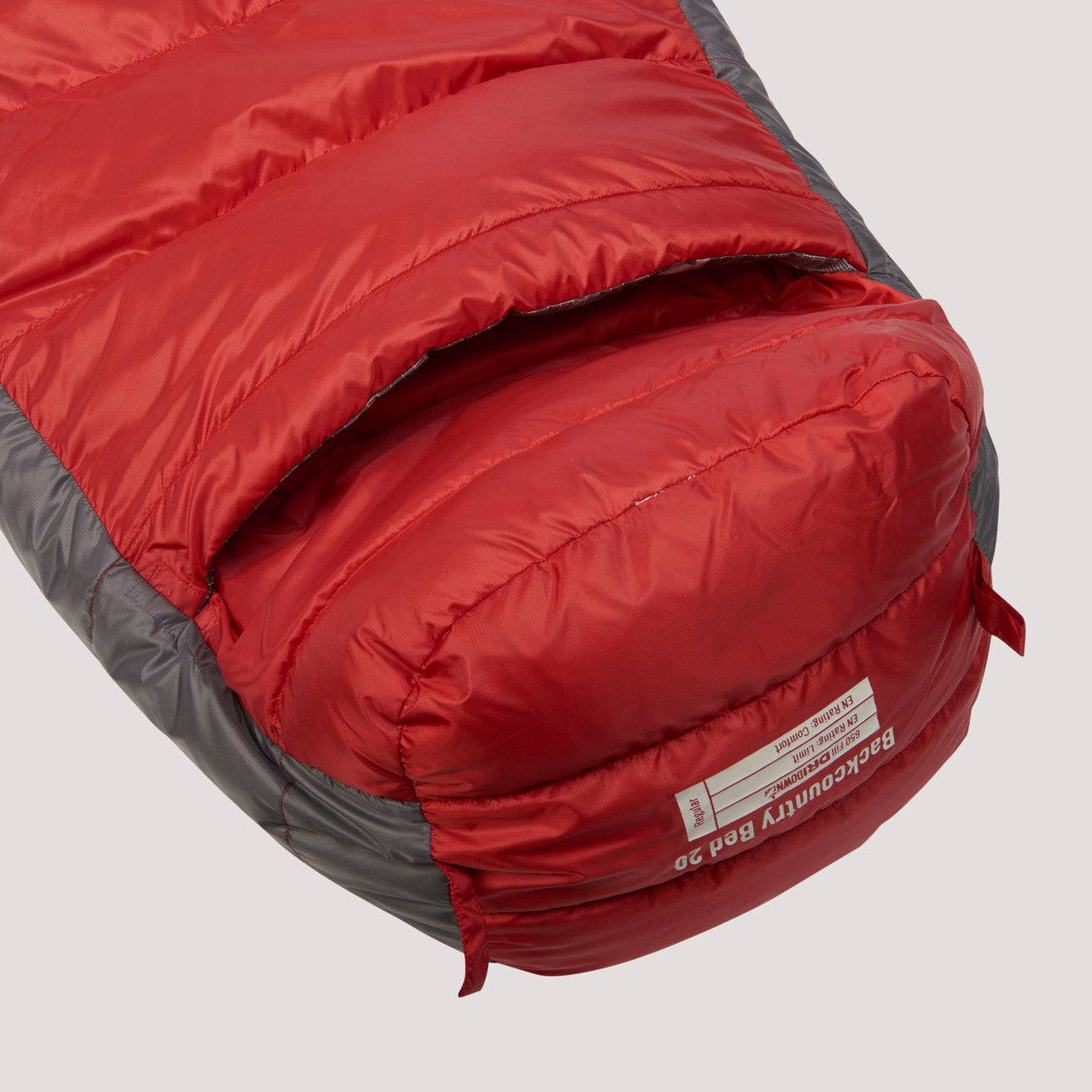 Close up of foot vent on the bottom of the Sierra Designs Backcountry Bed 650 / 20 Degree sleeping bag, red