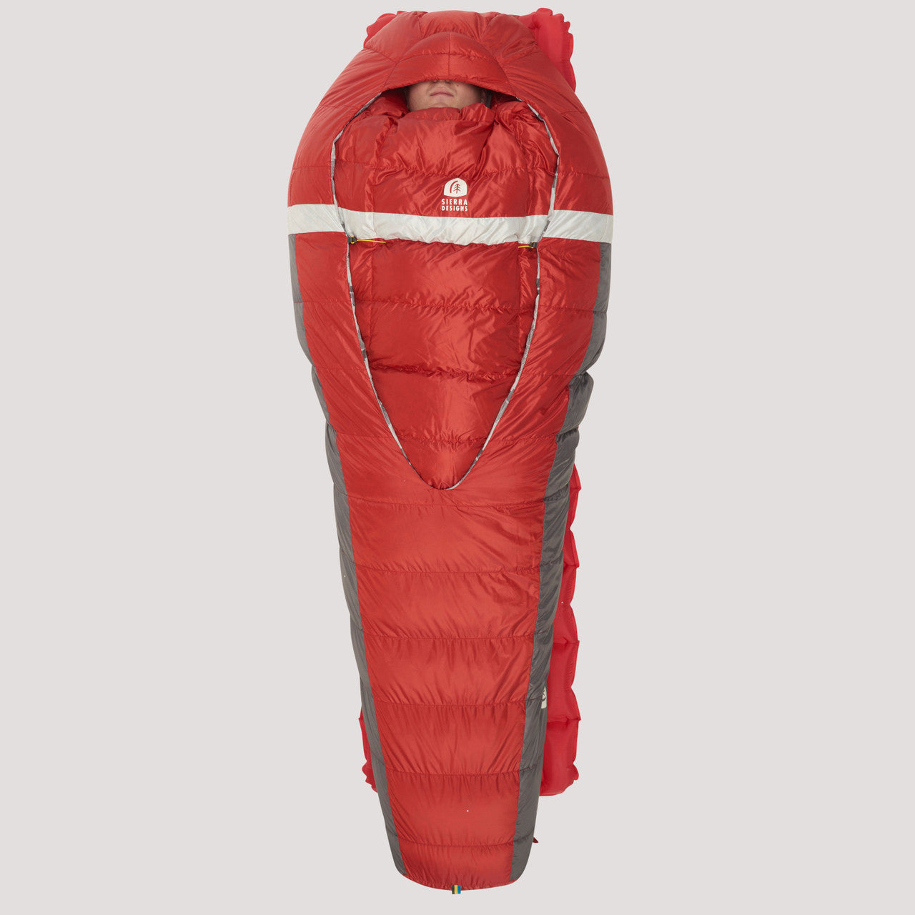 Man sleeping on his back in Sierra Designs Backcountry Bed 650 / 20 Degree sleeping bag, with bag closed